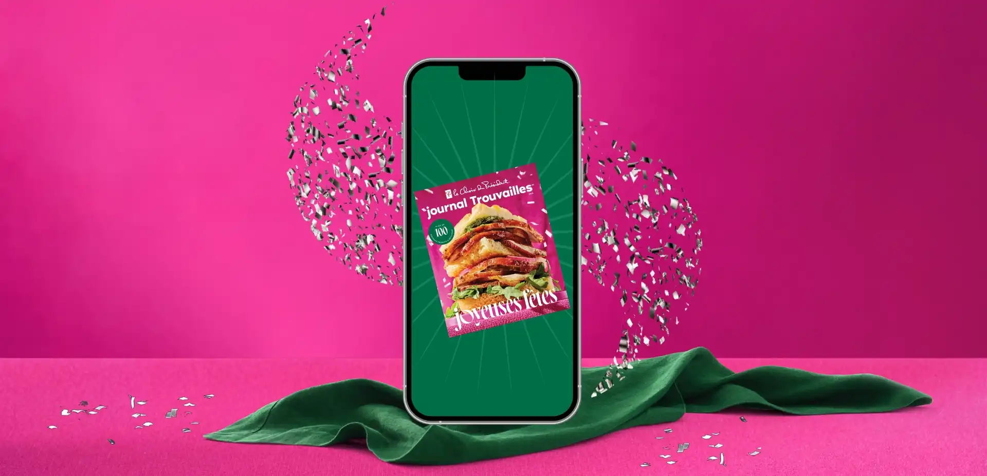 Des étincelles tourbillonnent autour de l'écran d'un smartphone qui affiche le magazine PC Insiders Report, tandis que des points rouges PC Optimum flottent autour de l'appareil.