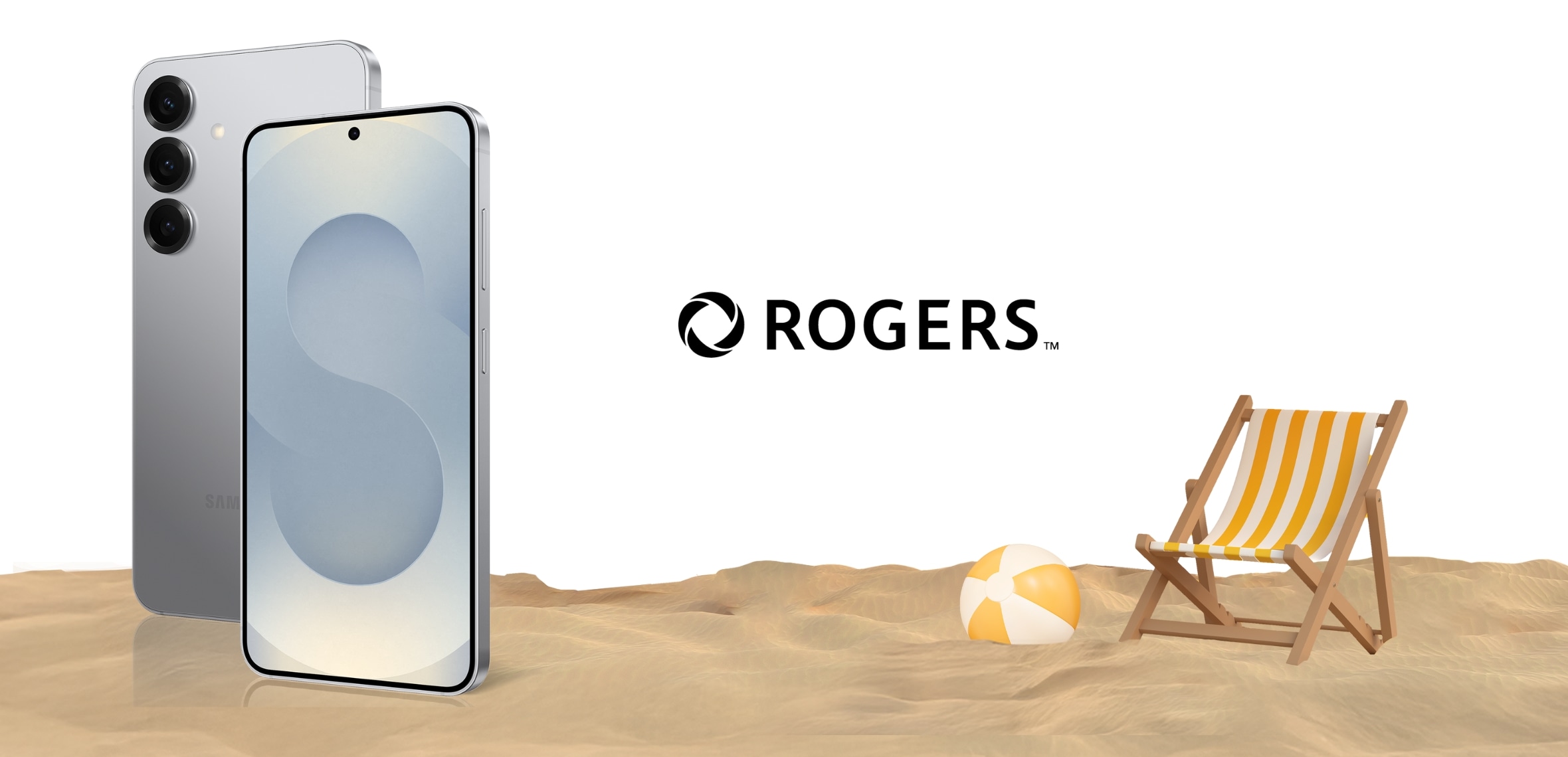 A silver Galaxy S25 rests on the sand of a beach with a blue sky above.