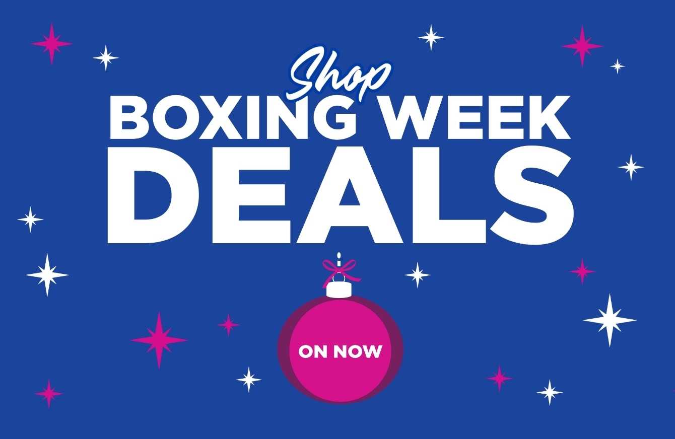 Boxing Week Event in glowing white cursive font above a pink bauble containing the words "ON NOW" surrounded by blue and pink sparkles on a deep blue background.